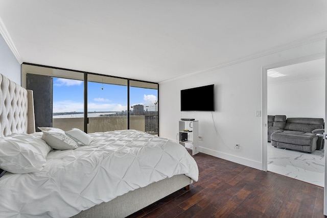 bedroom with dark wood-type flooring, ornamental molding, and a wall of windows