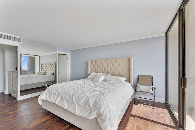 bedroom featuring dark hardwood / wood-style flooring and crown molding