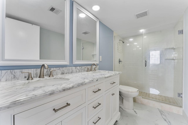 bathroom with vanity, toilet, and walk in shower