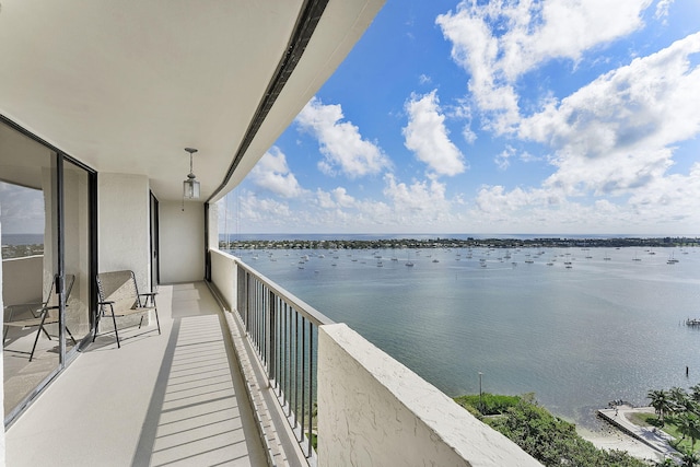 balcony featuring a water view