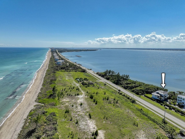 bird's eye view with a beach view and a water view