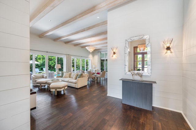 living room with beam ceiling, dark hardwood / wood-style flooring, and french doors