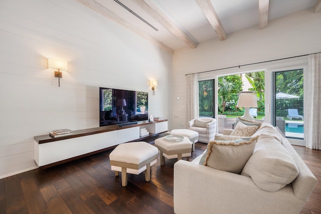 living room with dark hardwood / wood-style floors and beam ceiling