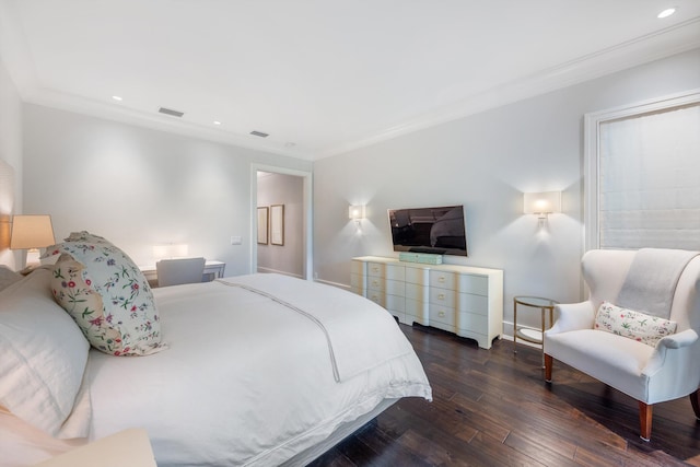 bedroom with dark hardwood / wood-style flooring and ornamental molding