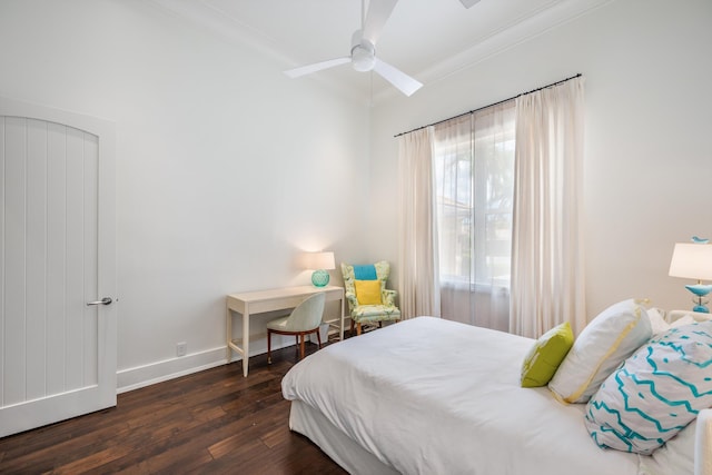 bedroom featuring vaulted ceiling, ornamental molding, dark hardwood / wood-style floors, and ceiling fan