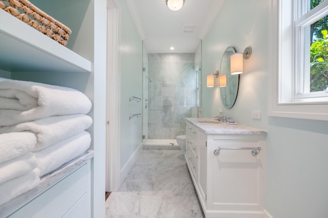 bathroom featuring vanity, toilet, and a shower with door