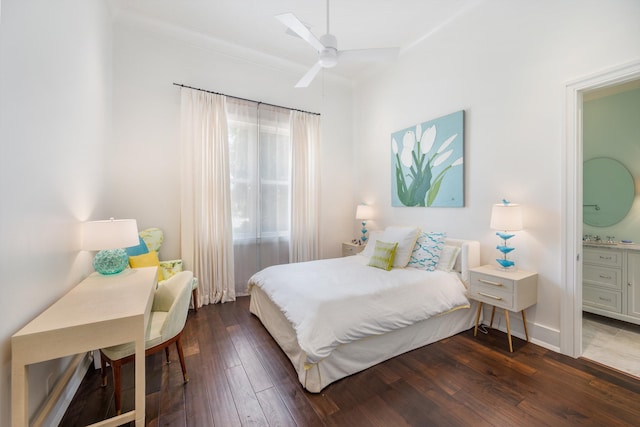 bedroom with dark wood-type flooring, ensuite bath, and ceiling fan