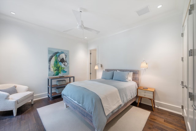 bedroom with ceiling fan and dark hardwood / wood-style flooring