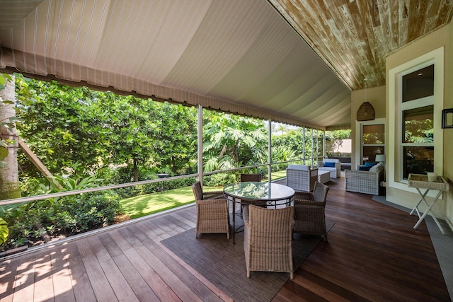 wooden deck with an outdoor living space