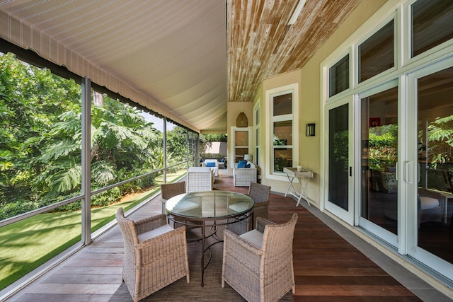 sunroom featuring wood ceiling