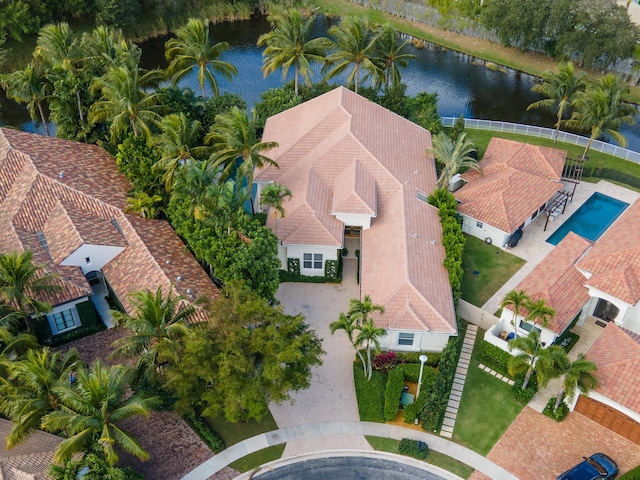 birds eye view of property featuring a water view