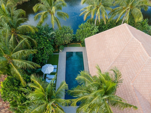 birds eye view of property with a water view