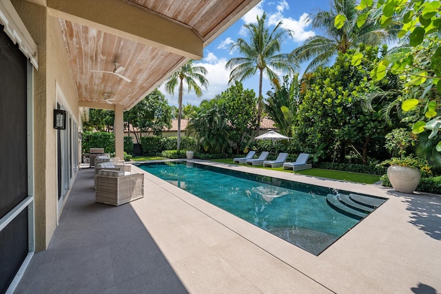 view of swimming pool featuring a patio area