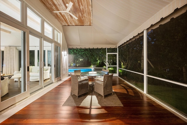 sunroom with vaulted ceiling and wooden ceiling