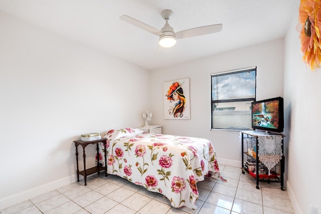 bedroom featuring light tile patterned flooring and ceiling fan