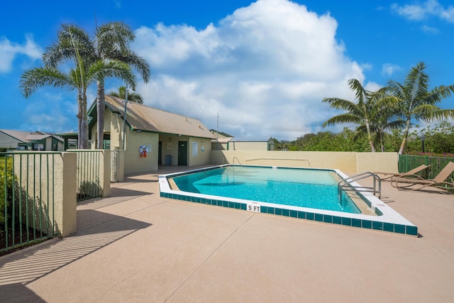 view of pool featuring a patio