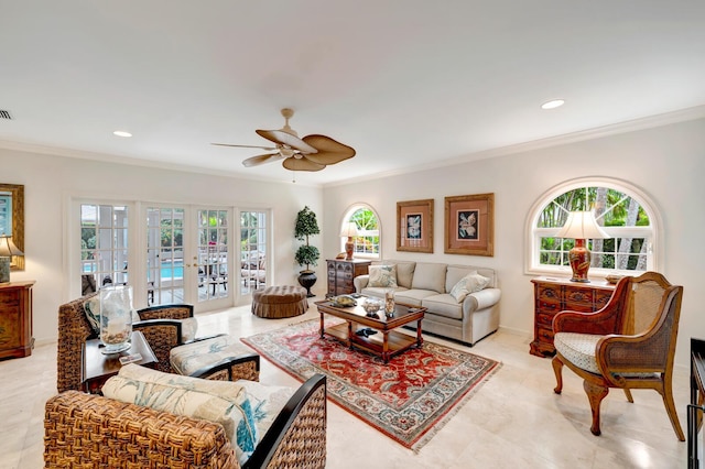 living room featuring ornamental molding, ceiling fan, and french doors