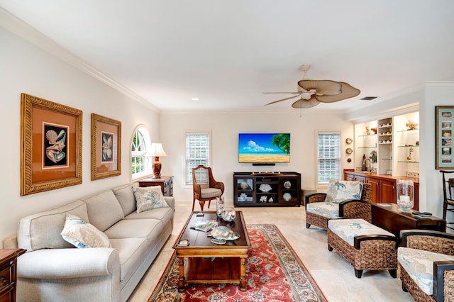 tiled living room with ceiling fan and ornamental molding