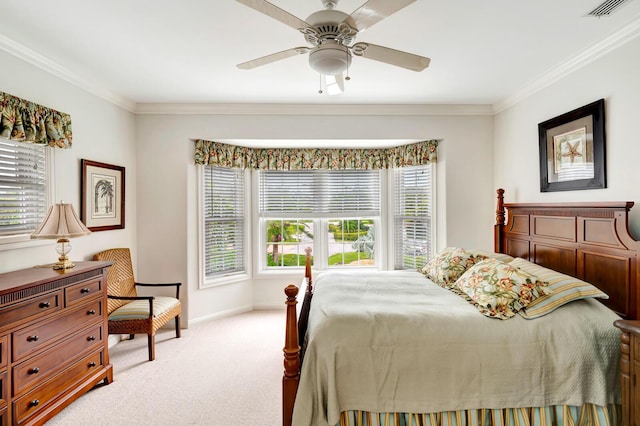 carpeted bedroom featuring ornamental molding and ceiling fan