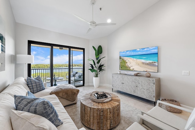 tiled living room featuring high vaulted ceiling and ceiling fan