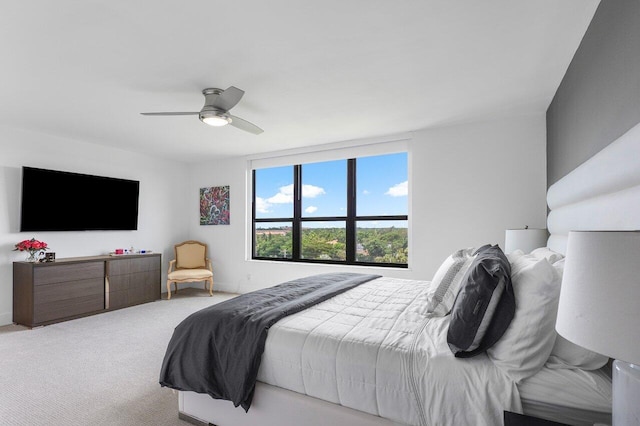 bedroom featuring ceiling fan and light colored carpet