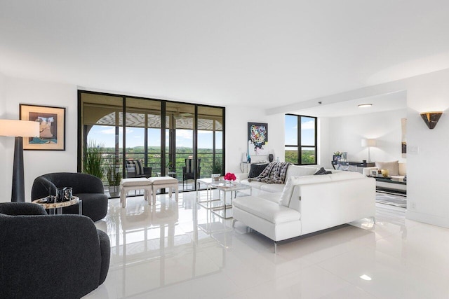 tiled living room featuring floor to ceiling windows and a healthy amount of sunlight