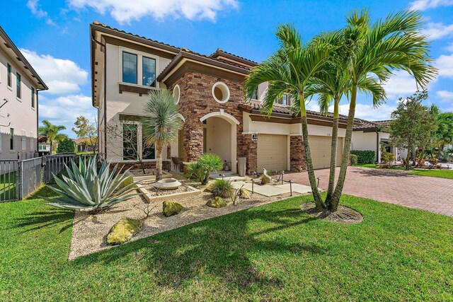 3134 Streng Ln, Royal Palm Beach, FL 33411 - mediterranean / spanish house with decorative driveway, stucco siding, stone siding, and a tile roof
