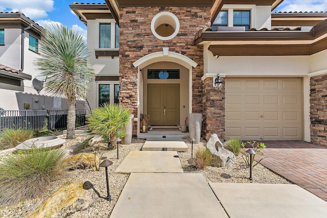 3134 Streng Ln, Royal Palm Beach, FL 33411 - entrance to property with stone siding, fence, stucco siding, and a garage