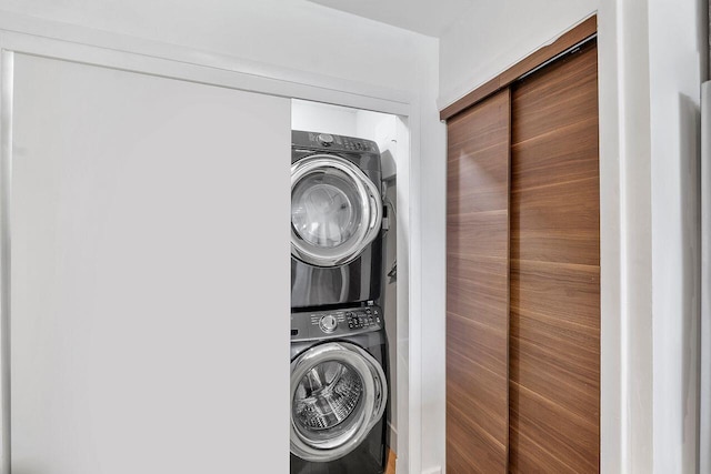 laundry room featuring stacked washer and clothes dryer