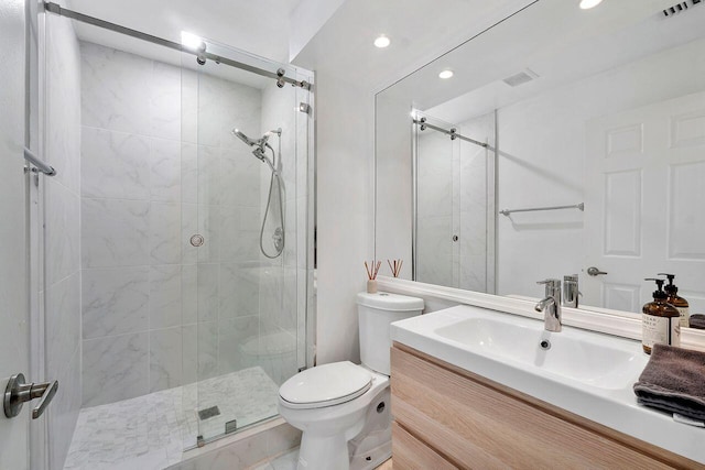 bathroom featuring vanity, toilet, and walk in shower