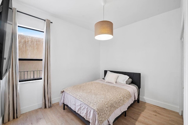bedroom with light hardwood / wood-style flooring