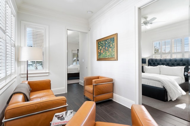 bedroom featuring multiple windows, dark wood-type flooring, and ornamental molding