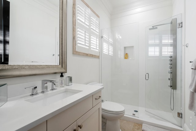 bathroom with crown molding, a shower with shower door, toilet, and a healthy amount of sunlight