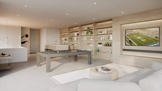 recreation room featuring built in shelves