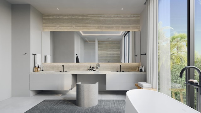 bathroom featuring vanity, a tub to relax in, and tile patterned floors