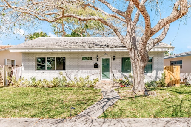 ranch-style house with a front yard