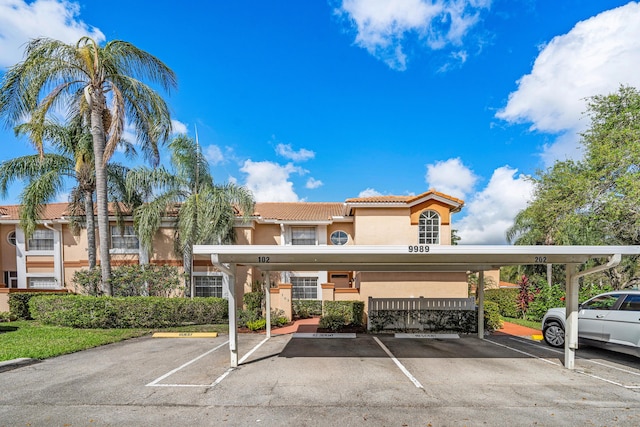 view of vehicle parking with a carport