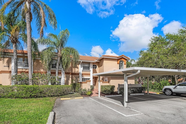 view of parking with a carport