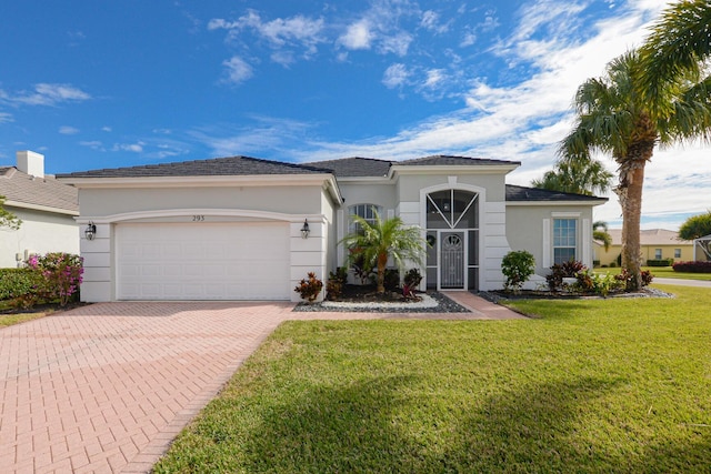 view of front of home featuring a garage and a front yard