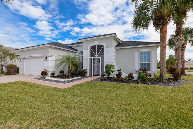 single story home with a garage and a front yard