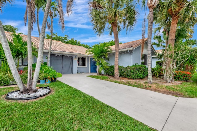 ranch-style house with a front lawn and a garage