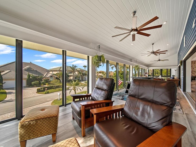 sunroom / solarium featuring lofted ceiling and wood ceiling