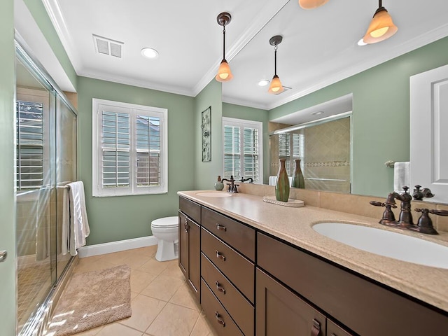 bathroom with vanity, an enclosed shower, crown molding, toilet, and tile patterned floors