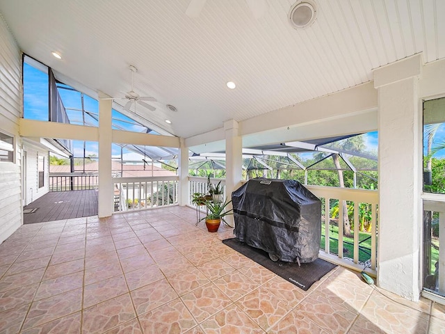 view of patio / terrace with ceiling fan, a lanai, and grilling area