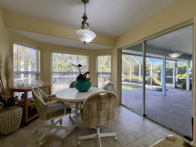 sunroom / solarium featuring vaulted ceiling