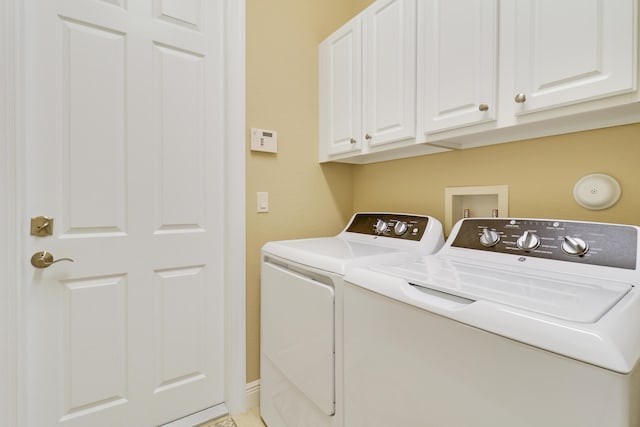 laundry area with cabinets and washer and dryer