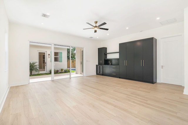 unfurnished living room with recessed lighting, light wood finished floors, visible vents, and ceiling fan