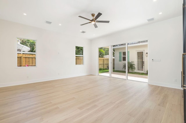 empty room featuring recessed lighting, light wood-style floors, baseboards, and a ceiling fan