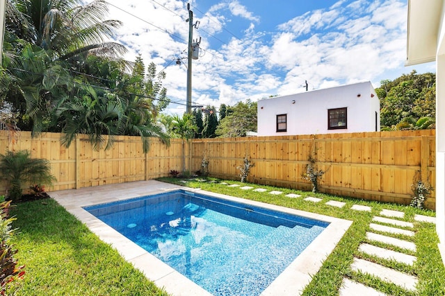 view of swimming pool featuring a fenced backyard