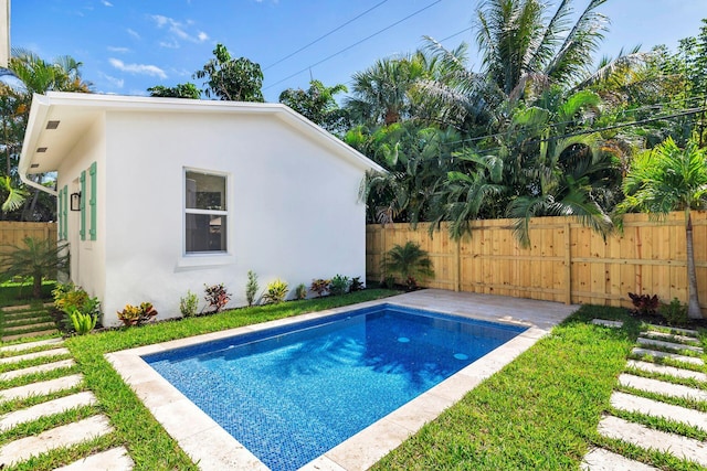 view of swimming pool featuring a fenced in pool and fence
